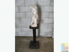 Figurine and pedestal
