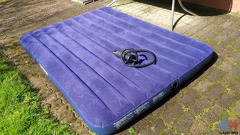 Inflatable mattress with a pump